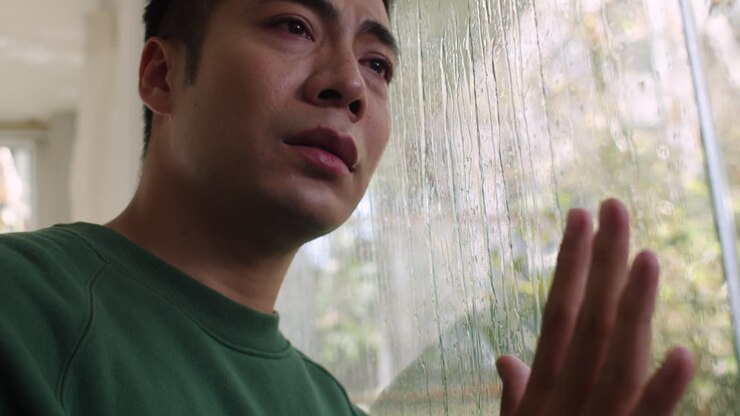 Man looking through the window
