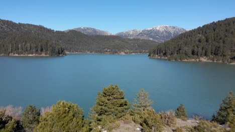 Aerial-view-of-the-Aoos-lake-in-Zagori-of-Epirus-Greece-sunny-day