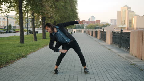 Man Dancing in a City Park