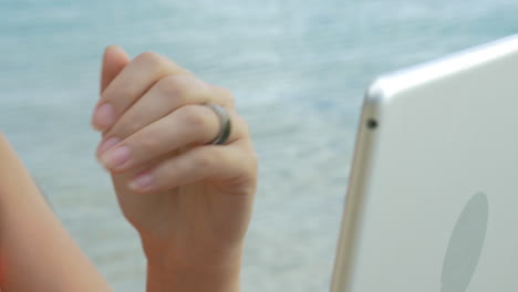 woman using smart ring to control computer