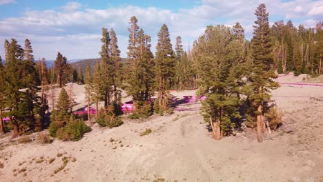 gimbal dolly shot from gondola as it passes by the ski and snowboard jumps during the summer on mammoth mountain, california