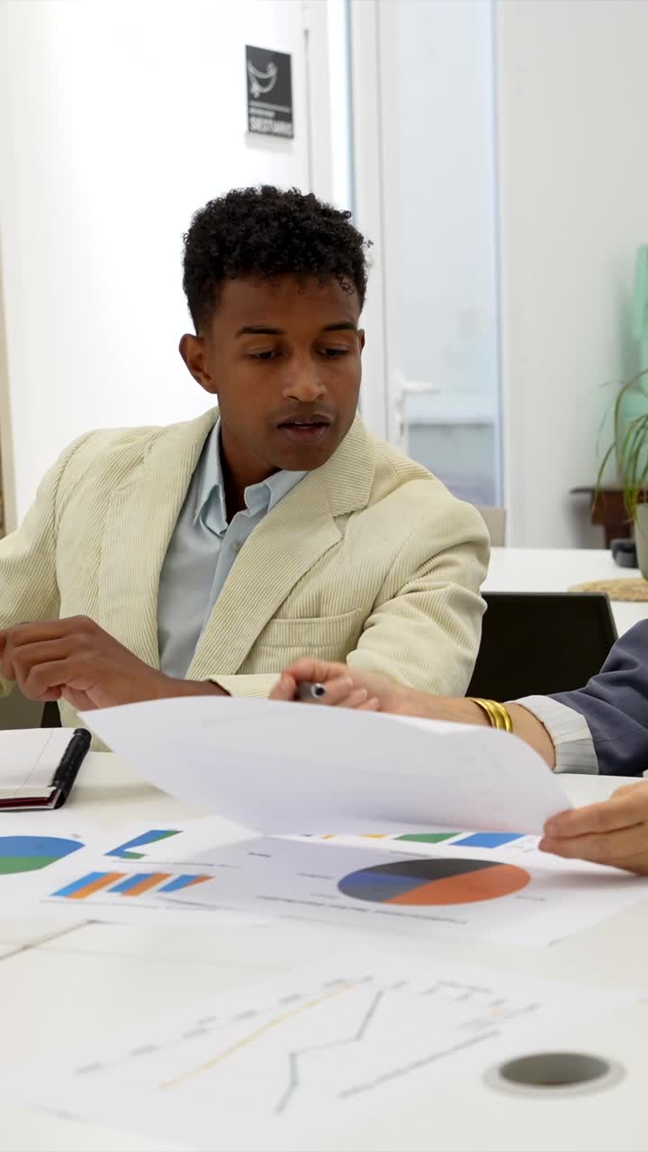 Business meeting with charts and data analysis