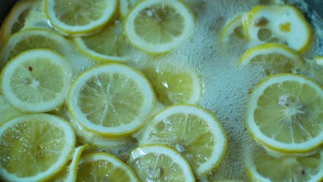 pov to the lemon sliced in boiling sugar for making lemonade