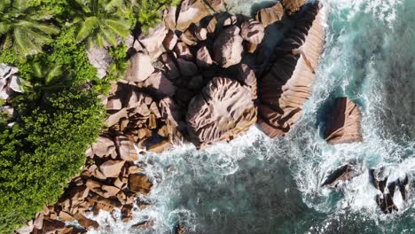 Aerial-view-of-the-white-beaches-and-turquoise-waters-at-Anse-Coco,-Petit-Anse-and-Grand-Anse-on-La-Digue,-an-island-of-the-Seychelles