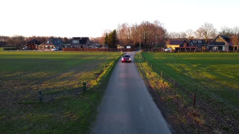 Drone-shot-of-Alfa-Romeo-car-driving-towards-the-camera