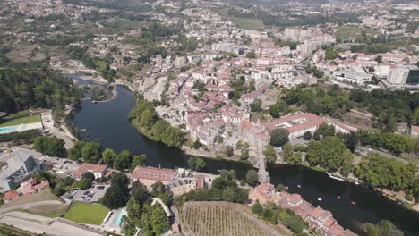 establishing aerial above view of the historic parish townscape and famous sao goncalo church, amarante