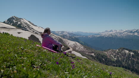 woman relaxing on a mountain slope