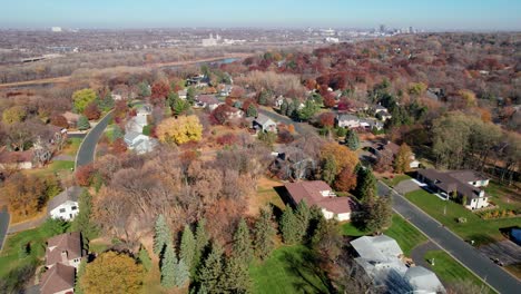 drone aerial panning up showing a high end neighborhood in minnesota