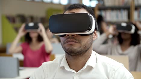 front view of focused guy wearing vr headset