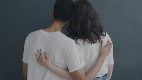 couple hugging back view