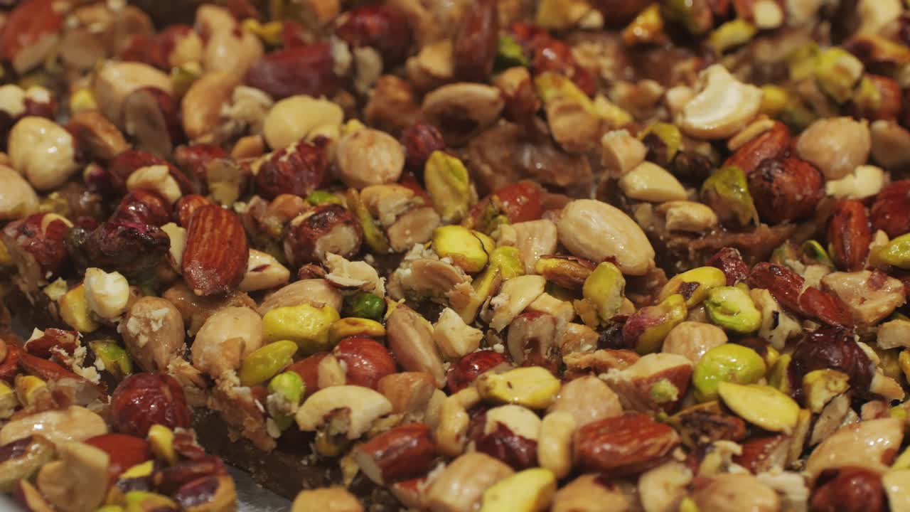 Enjoy these delicious and nutty snack bars topped generously with a variety of nuts and seeds for a healthy treat