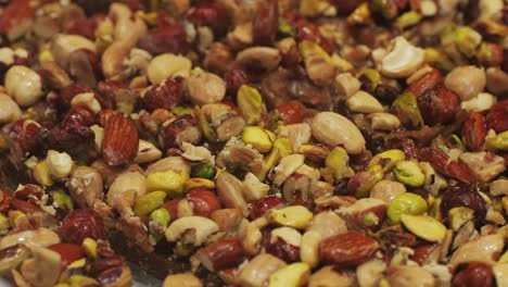 enjoy these delicious and nutty snack bars topped generously with a variety of nuts and seeds for a healthy treat