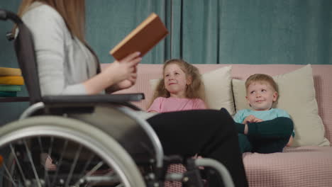 adorable sister and brother listen to mom reading funny tale