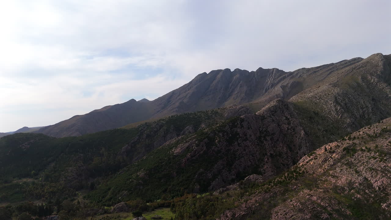 Drone flys left, showcasing the majestic Sierra de la Ventana's peaks and valleys - Buenos Aires, Argentina