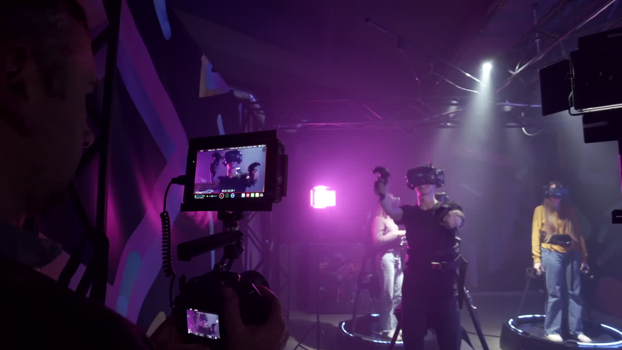 Camera filming a boy playing with a Virtual Reality headset