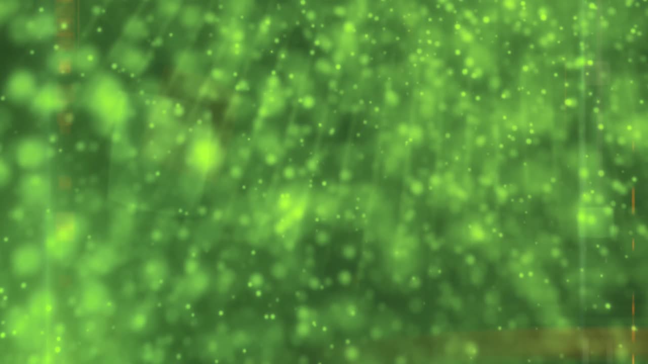 抽象的な緑の粒子と光線の背景