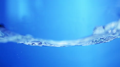 crystal droplet on a smooth water surface