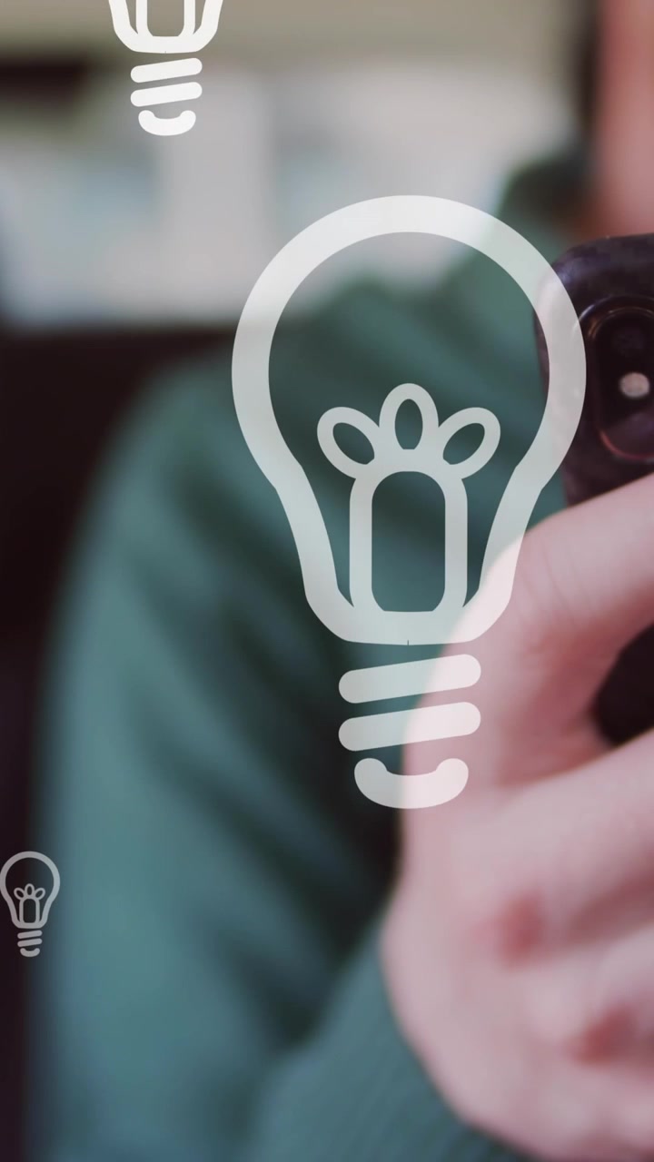 Animation of light bulb icons and data processing over african american albino man using smartphone