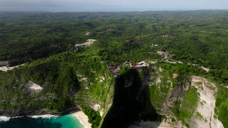 Bird's-eye-view-of-Kelingking-Beach-and-cove-of-Nusa-Penida-island,-Bali-in-Indonesia