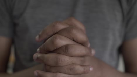 close up of adult asian male hands interlocked