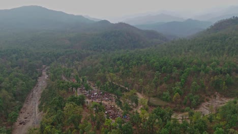 hundreds have taken long-term shelter near the highway in surkhet, nepal, after a major flood washed away their homes, highlighting the prolonged impact of natural disasters on vulnerable communities.