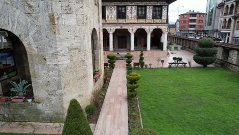 drone view rising from the courtyard of the alaca mosque, in the middle of the cultural structure tetovo