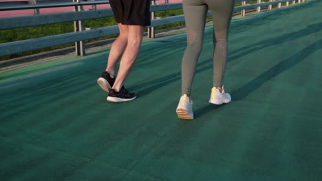 couple running on a track