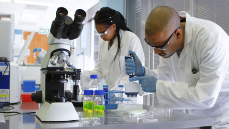 team of scientists experimenting together 4k