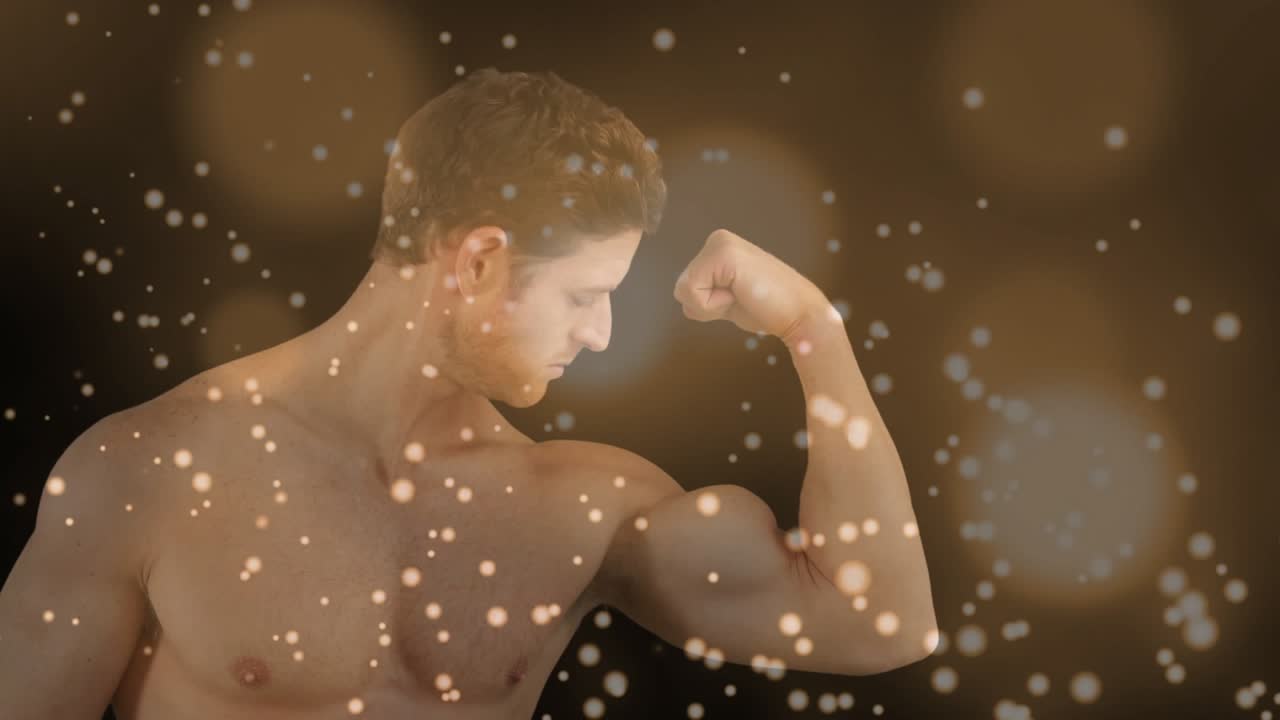 Fitness model posing to show right arm, bending elbow, tensing while warm bokeh drifting over model
