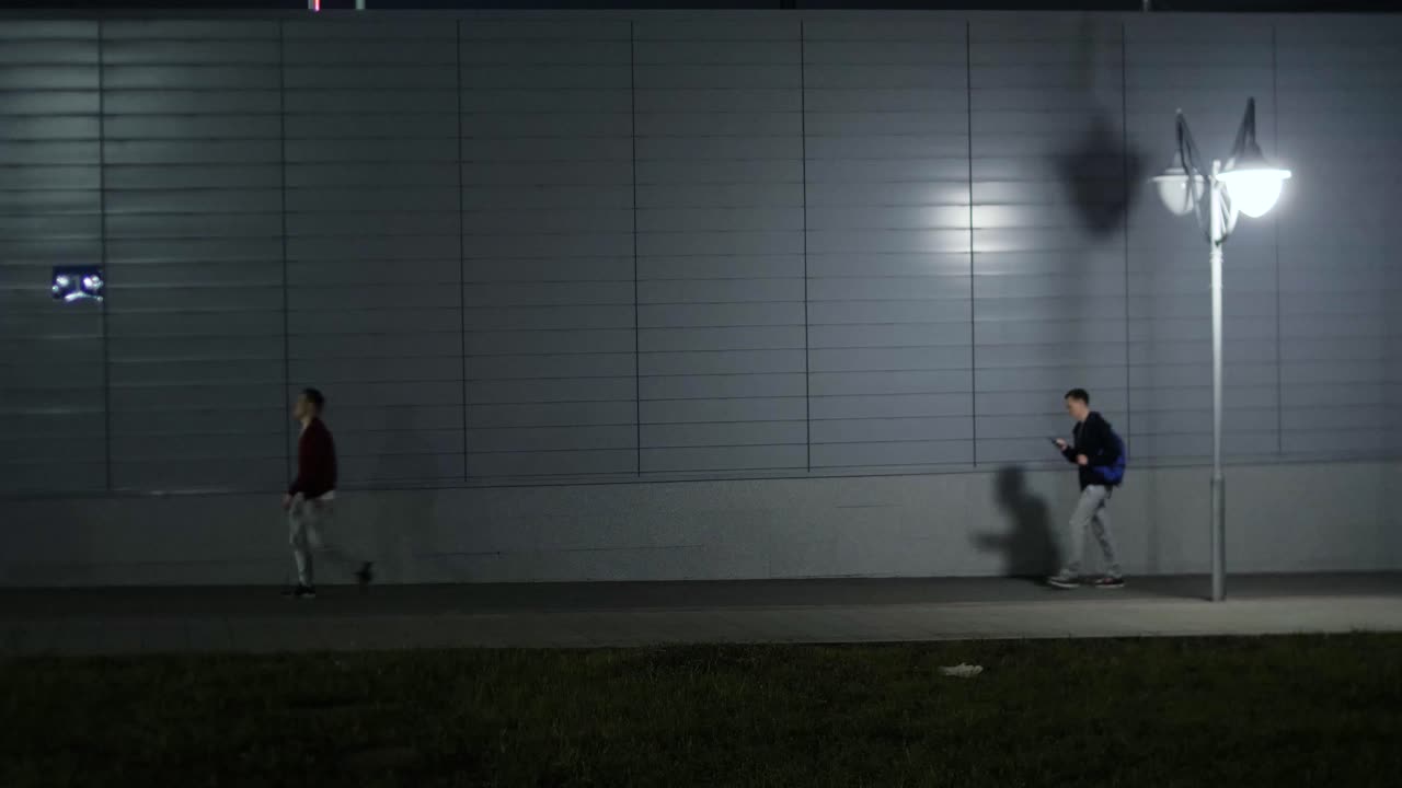 People walking at night on a city street