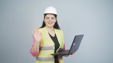 engineer waving at camera.