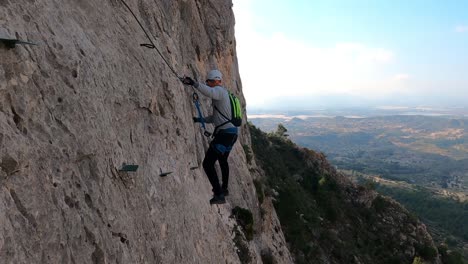 Via-ferrata-ascension-by-group-of-friends