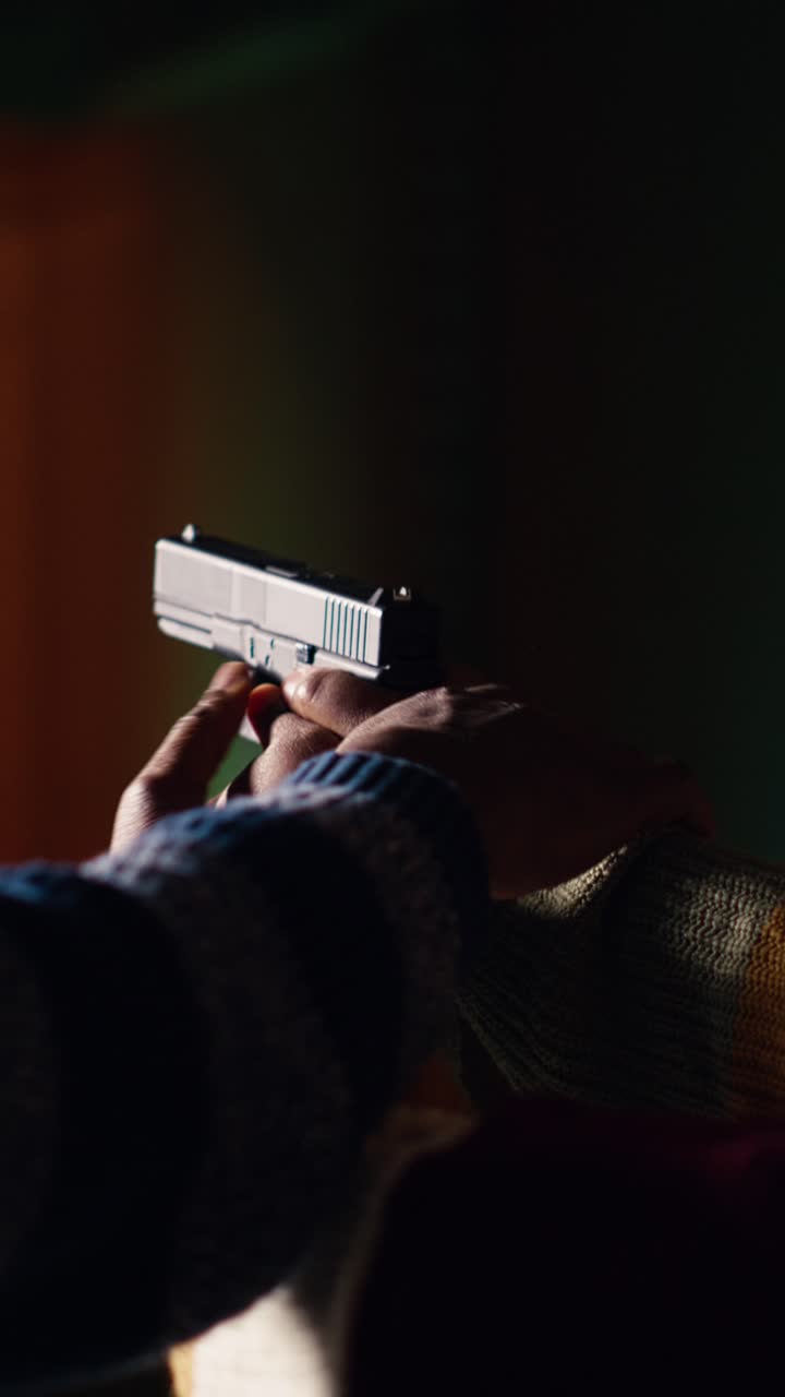 Vertical video Shooting gallery worker teaching student how to hold pistol, close up