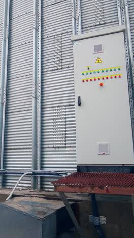 work of an elevator with a generator. steel grain silos for grain storage. grain storage elevators with generator. vertical video