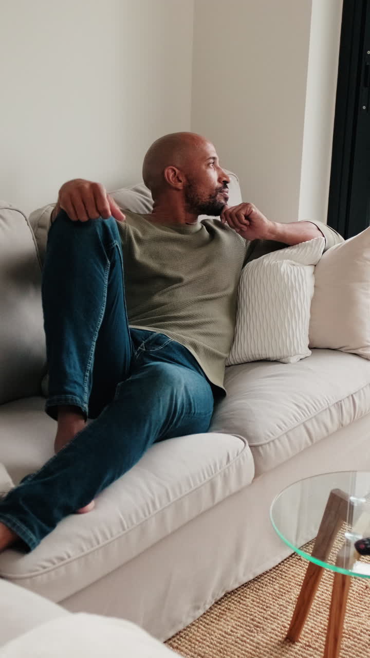 Man Relaxing at Home on Sofa