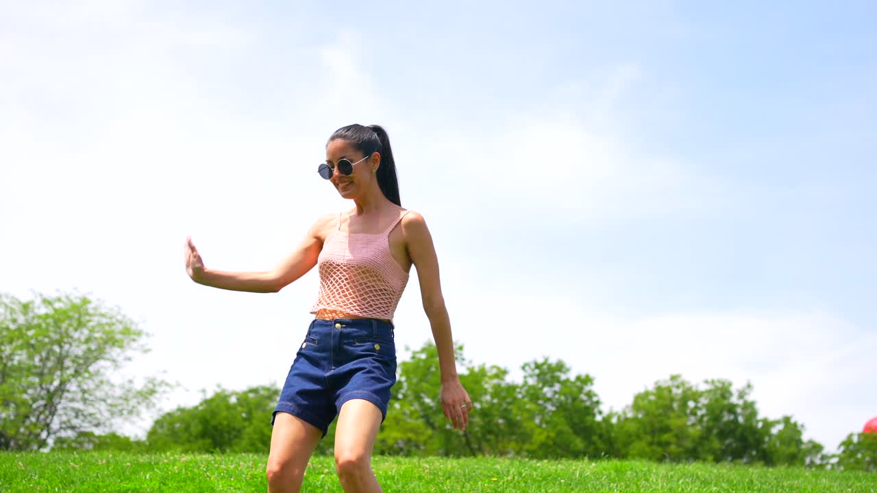 A woman poses in a field