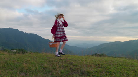 medieval renaissance costume clothing fashion female model walking alone in mountains scenic european landscape historical reproduction