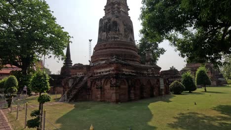 touring historic temple ruins with lush greenery