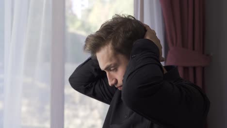 thoughtful young man is stressed from thinking.