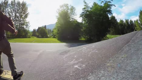 man rides a skateboard on the road 4k