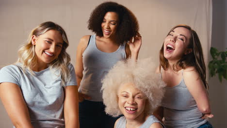 portrait of casually dressed women friends one with disabled limb promoting body positivity studio