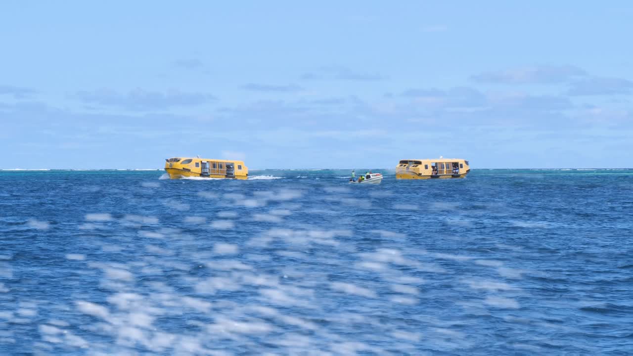 Life boats of a cruise ship bringing passengers to the beach of Mystery Island, Vanuatu.