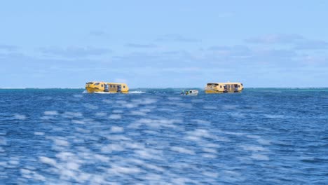life boats of a cruise ship bringing passengers to the beach of mystery island, vanuatu.