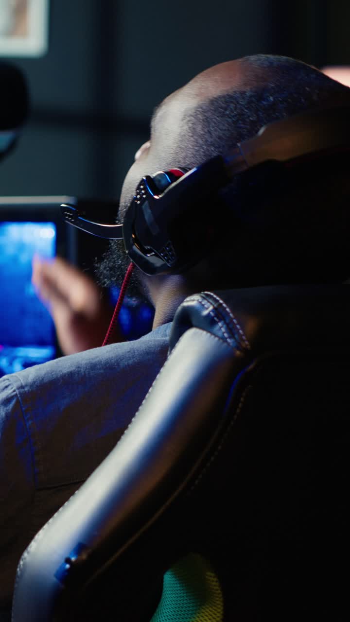 Vertical video Gamer feeling upset after being defeated by rival players in game