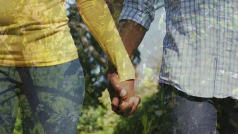 Animation-of-trees-over-african-american-couple-holding-hands