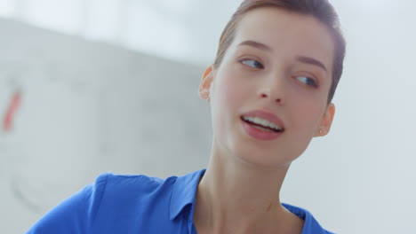 Business-woman-looking-white-board-office.-Female-mentor-talking-people-indoors