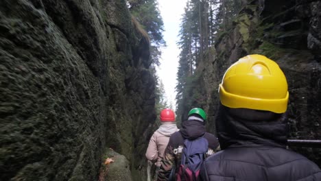 an adventure group passes through a mountain canyon an active team on an expedition in a mountainous an adventure group passes through a mountain canyon an active team on an expedition in a mountainous area