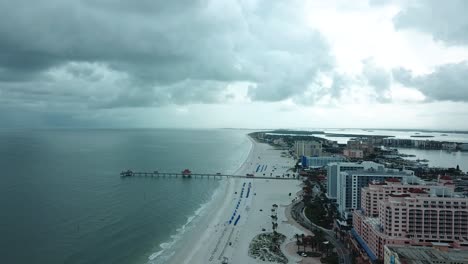 aerial view of hotels on a white sand beach in clearwater, florida on a cloudy sky