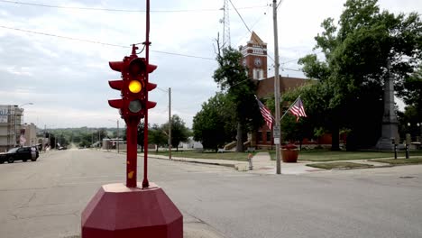 antique four way stop light and courthouse in downtown toledo, iowa with stable video close up