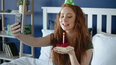 tracking left video of woman taking selfie with birthday cake